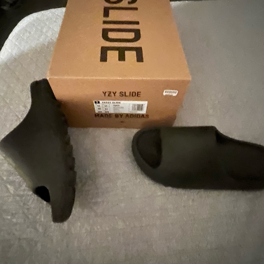 Selling YEEZY slides men’s size 11 in the onyx color by Adidas.